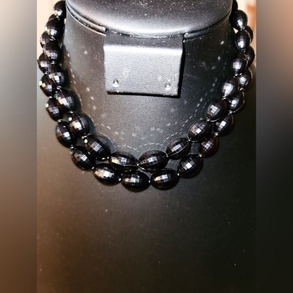 Double strand black necklace.